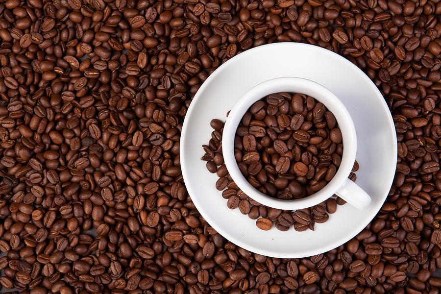 Cup Of Coffee Beans Photograph by Raimond Klavins