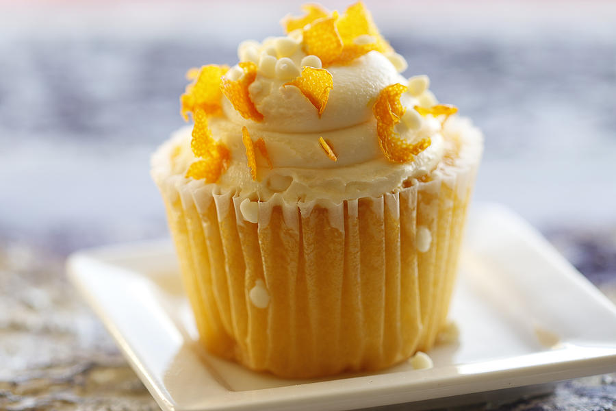 Cupcake with orange zest on light background Photograph by Nanette J.Stevenson-ebbystouch.com