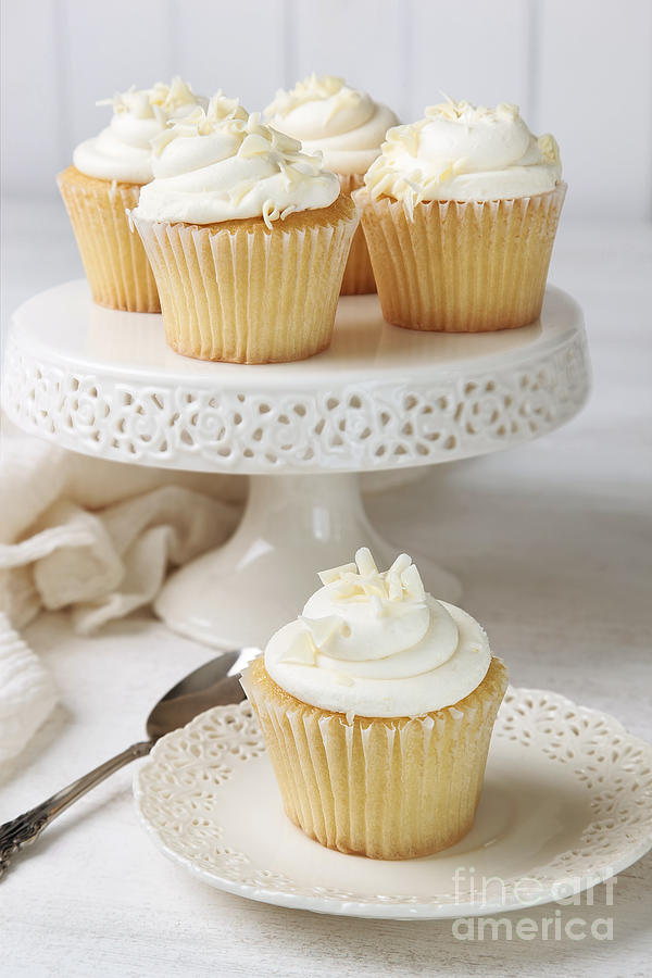 Cupcakes decorated with icing and white chocolate Photograph by Sandra Cunningham