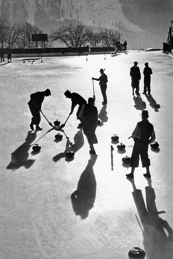 Black And White Photograph - Curling at St. Moritz by Underwood Archives