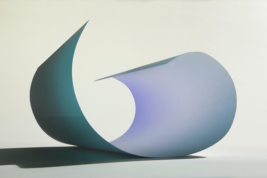 Curved Sheet Of Paper Photograph by Paul Taylor