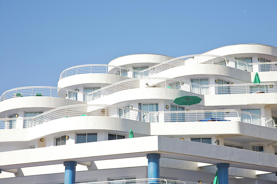 Curved White Balcony Bands Under Blue Photograph by Barry Winiker