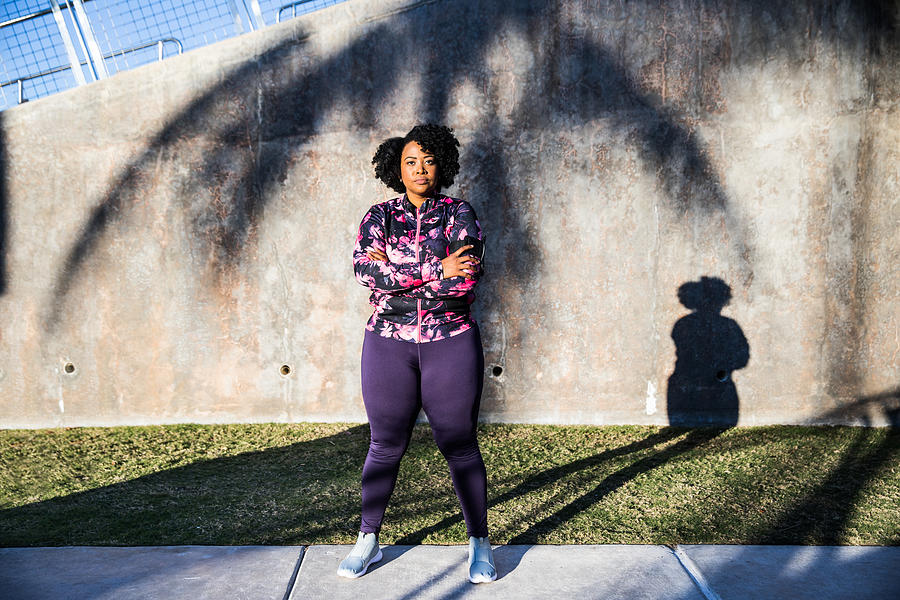 Curvy young black woman exercising, having sport training in the city public park Photograph by LeoPatrizi