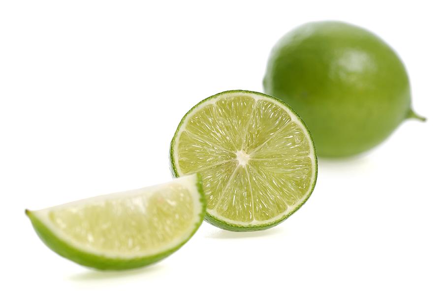 Lime Photograph - Cut limes by Science Photo Library