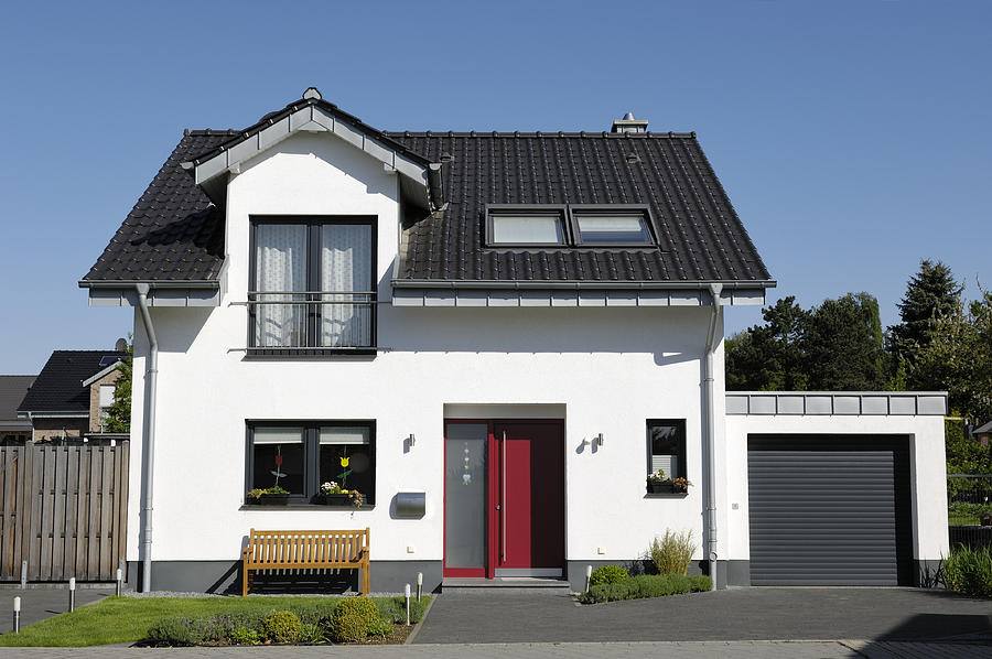 Cute one-family house with garage Photograph by Acilo