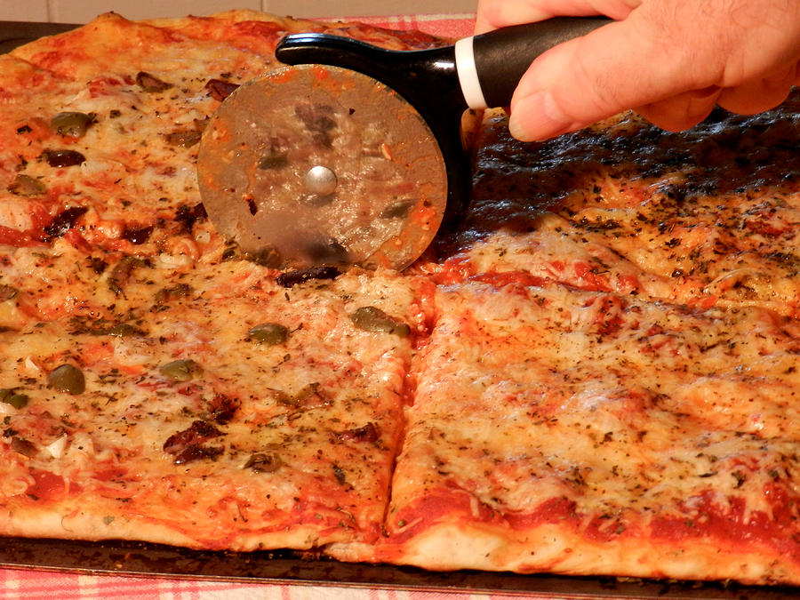 Cutting Pizza Photograph