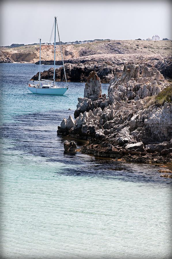 In Cala Pudent Menorca the Cutting rocks in contrast with turquoise sea show us an awsome place Photograph by Pedro Cardona Llambias