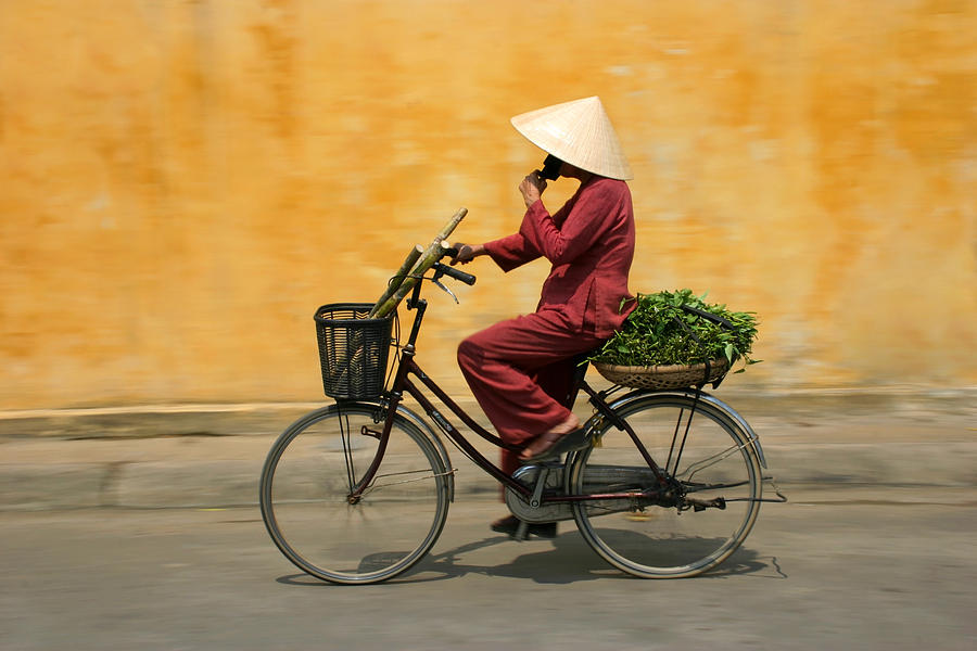 Cyclist in Vietnam Photograph by Keith Molloy