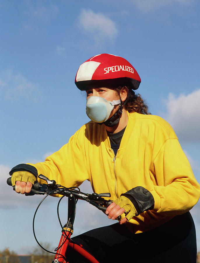 Cyclist Wearing Face Mask To Filter Out Fumes. Photograph by Hattie Young/science Photo Library