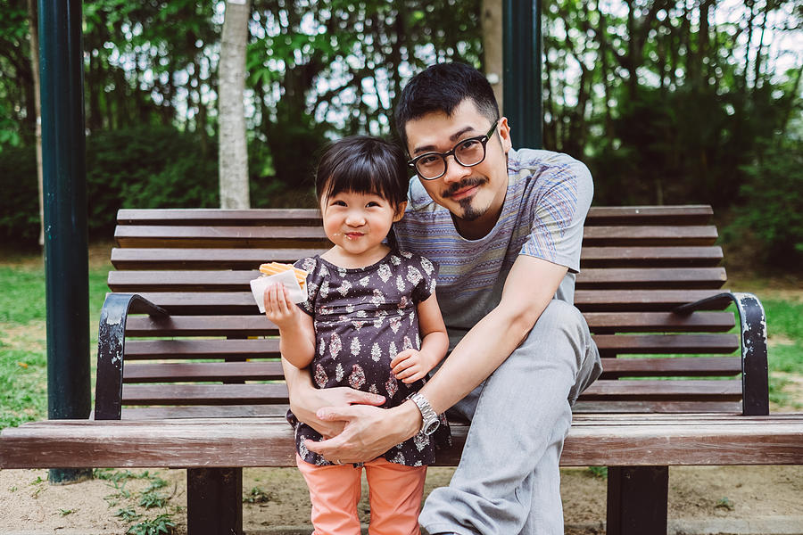Dad & little girl smiling at the camera in park Photograph by Images By Tang Ming Tung