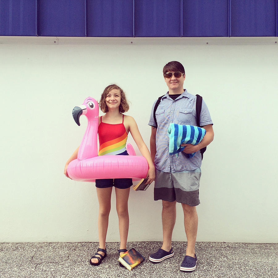 Dad and Daughter and Inflatable Flamingo Photograph by Cyndi Monaghan