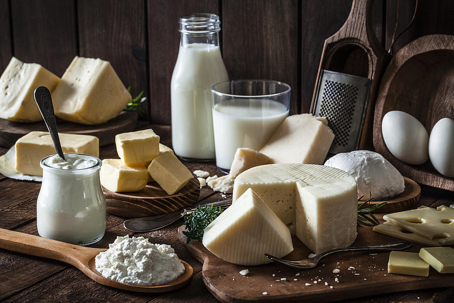 Dairy products shot on rustic wooden table Photograph by Fcafotodigital