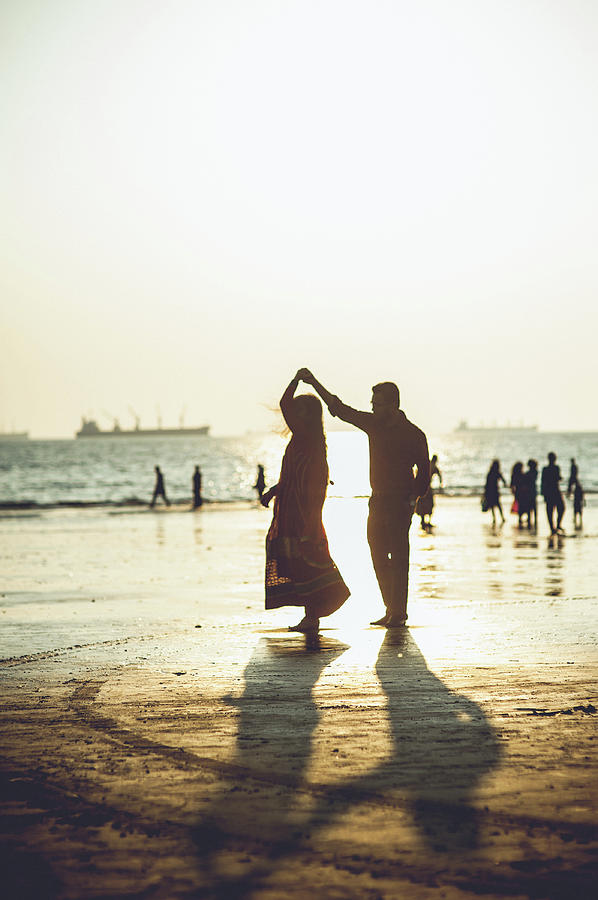 Dancing On The Beach Photograph by Copyright By Ata Mohammad Adnan