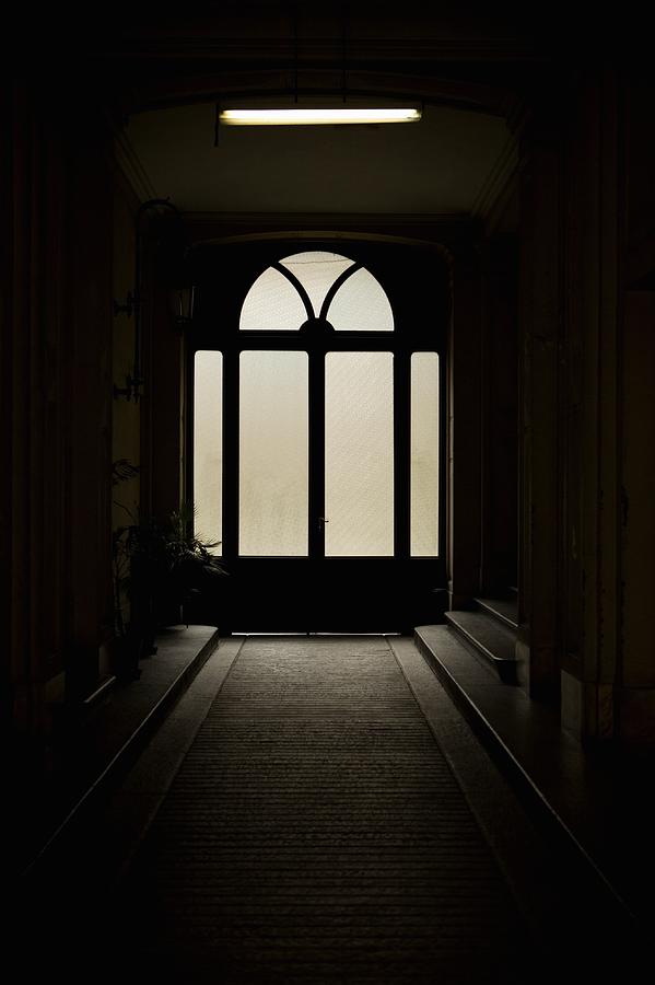 Dark entrance hall and door Photograph by Benne Ochs