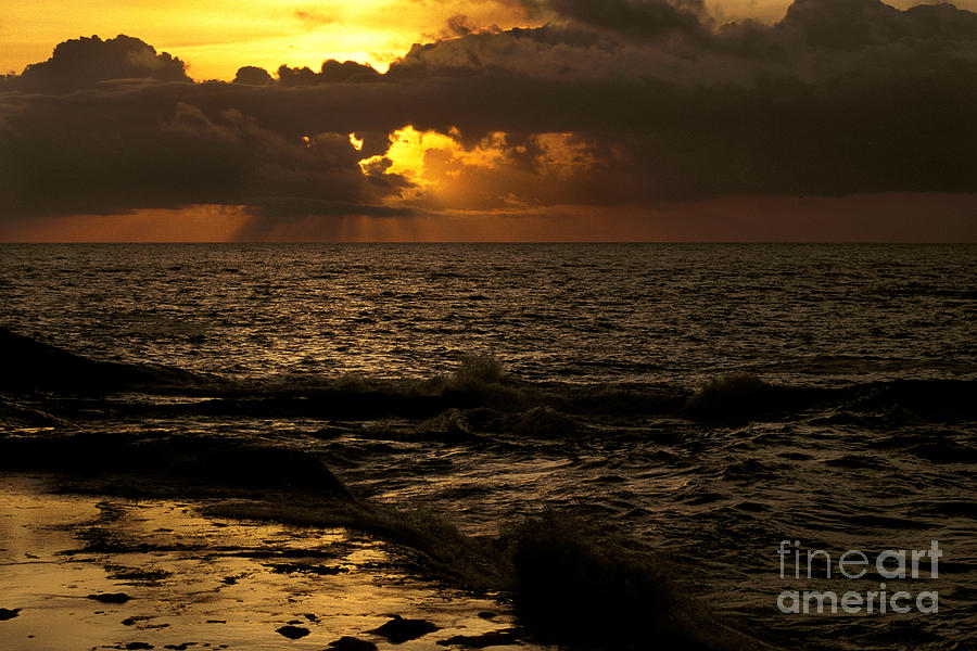 Dark Shoreline With Sun And Clouds Photograph by Ron Sanford