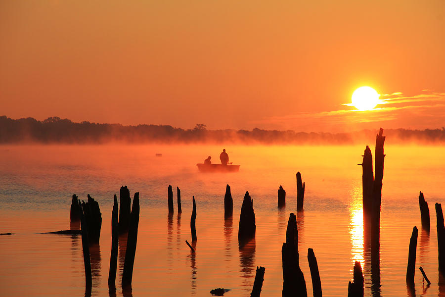 Sunset Photograph - Dawn Fishing by Roger Becker