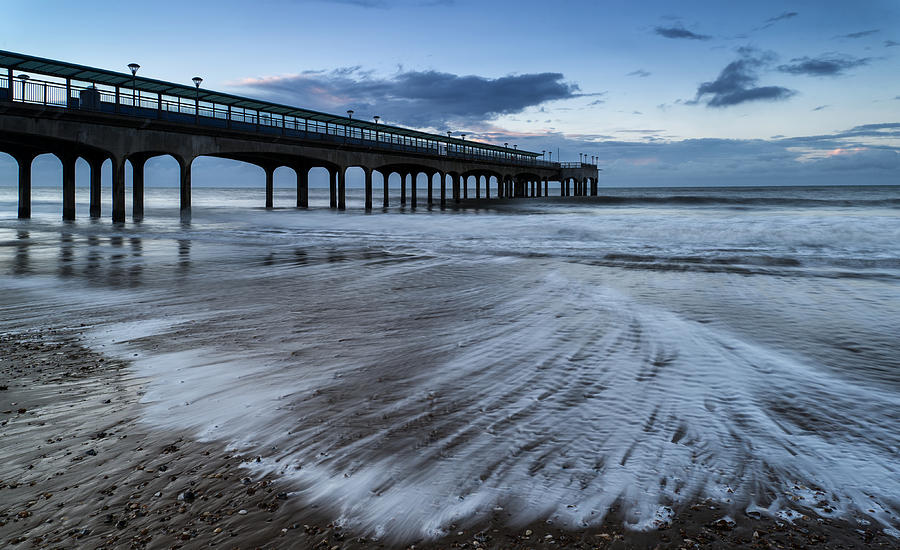 Dawn landscape of pier stretching out into sea Photograph by Matthew ...