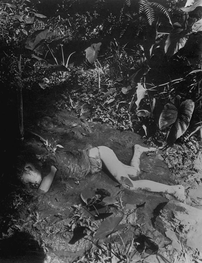 Dead Filippino Child Laying In Mud Photograph by Everett