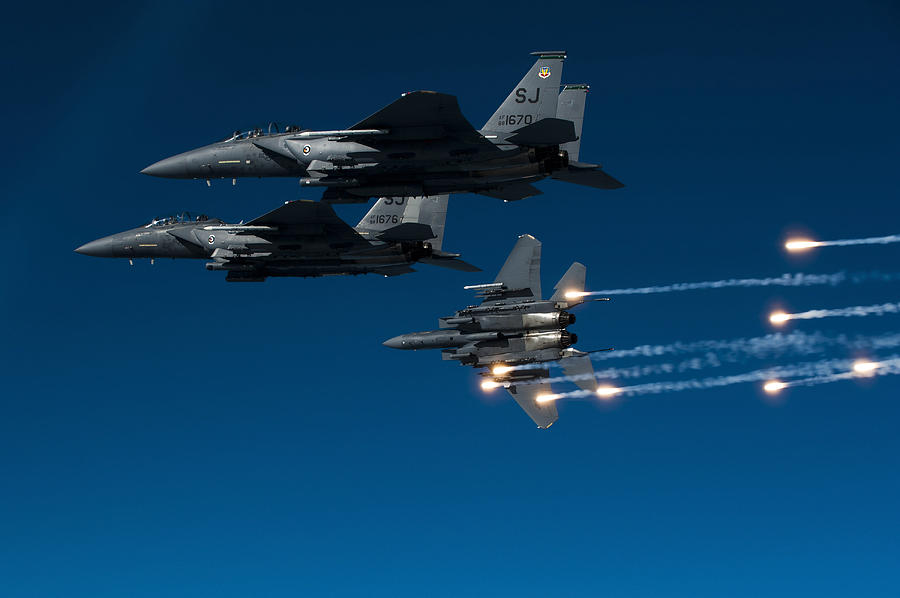 December 17, 2010 - A U.S. Air Force F-15E Strike Eagle aircraft releases flares during a local training mission over Seymour Johnson Air Force Base, North Carolina. Photograph by Stocktrek Images
