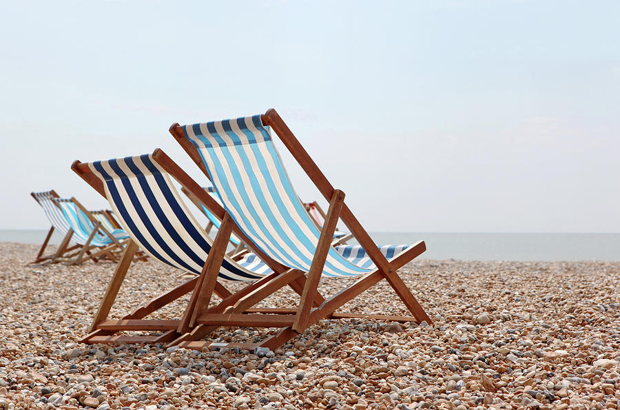 Deck Chairs On Beach Photograph by Richard Newstead