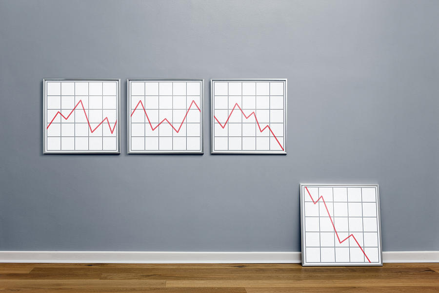 Declining line graph in picture frames Photograph by Jorg Greuel