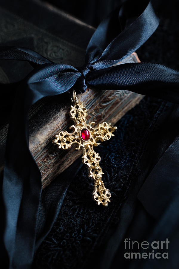 Decorative gold cross with satin ribbon on bible Photograph by Sandra Cunningham