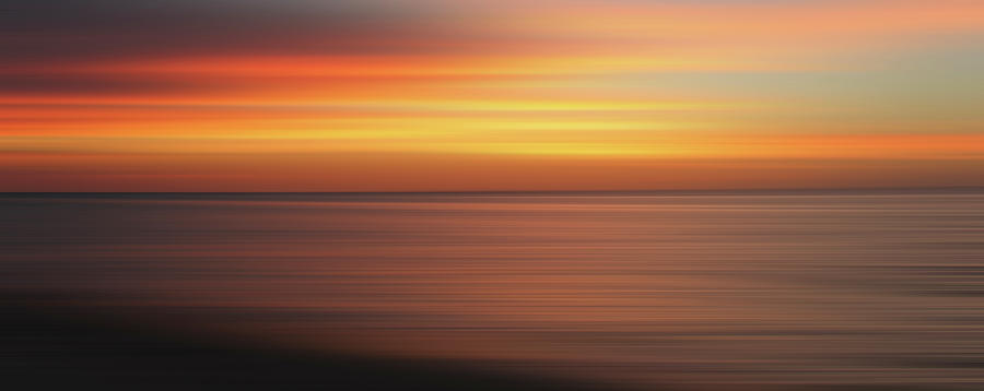 Defocused View Of Sunset Over Ocean Photograph by Ikon Ikon Images