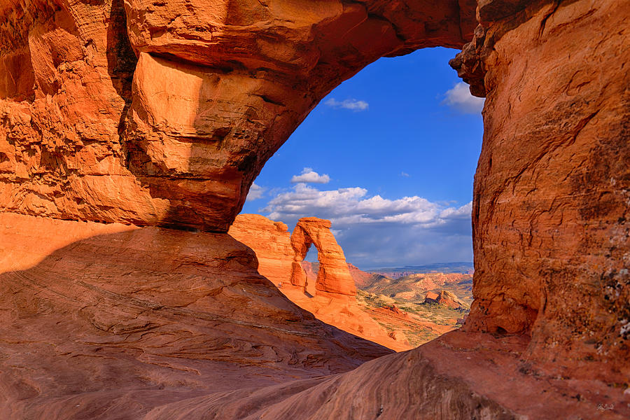 Delicate Arch Through A Window Photograph by Greg Norrell