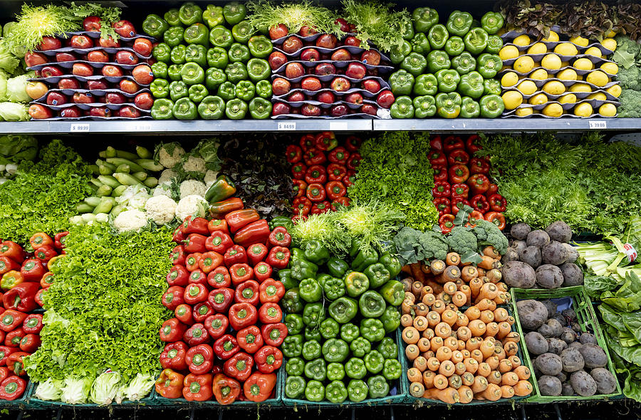 Delicious fresh vegetables and fruits at the refrigerated section of a supermarket Photograph by Hispanolistic