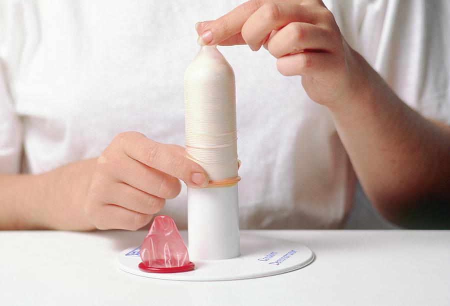 Demonstration Of The Correct Use Of A Condom Photograph By Gary Parker Science Photo Library
