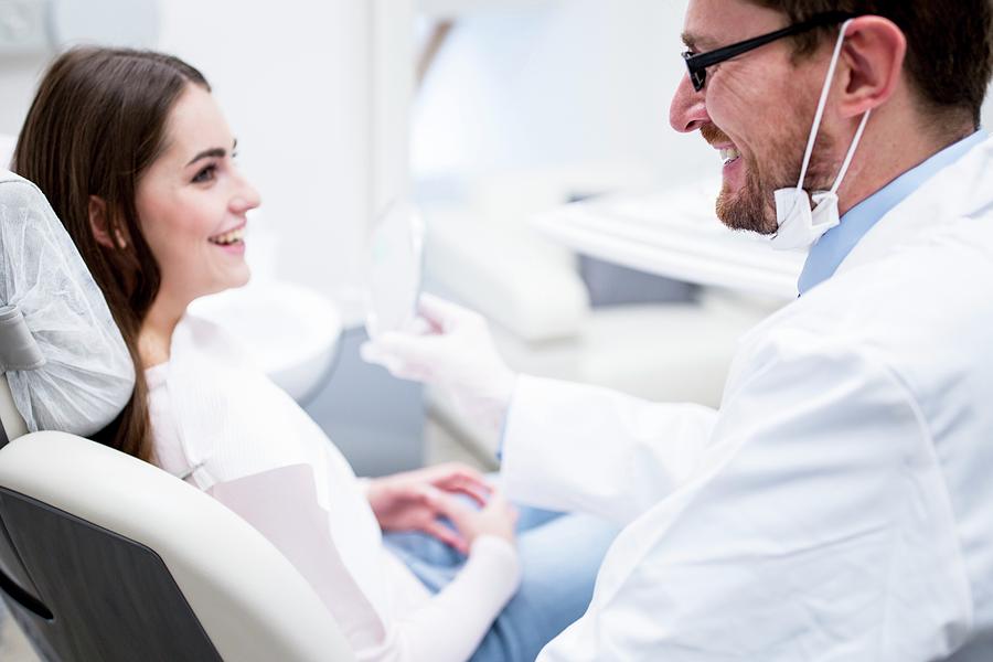 Dentist And Patient Smiling Photograph by Science Photo Library