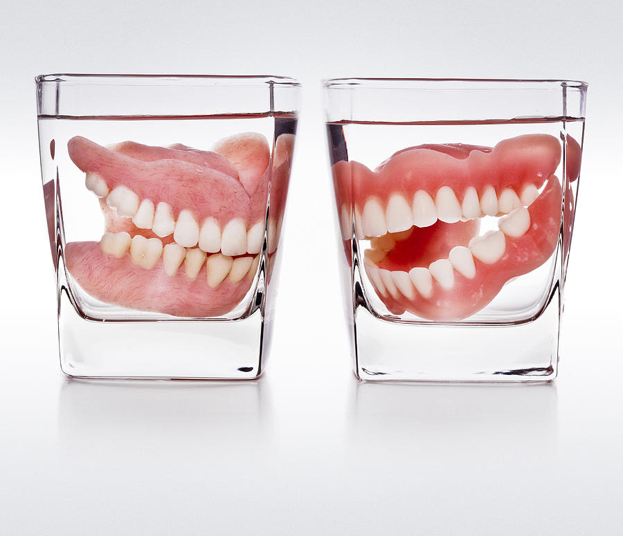 Dentures In A Glass Of Water Photograph by Thepalmer
