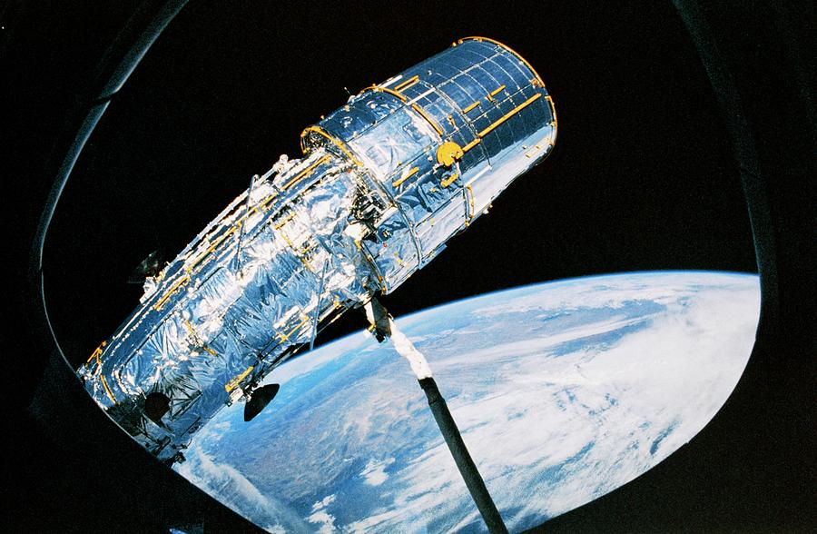 Deployment Of Hubble Space Telescope From Shuttle Photograph by Nasa/science Photo Library