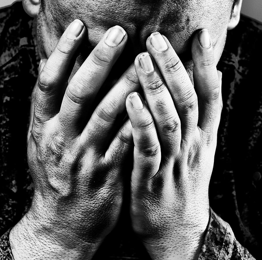 Depressed man, hands covering face Photograph by Ricardo Liberato