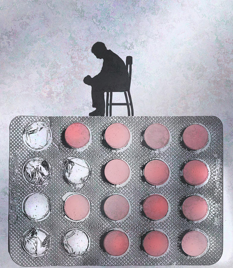 Depressed Man Sitting On Top Of Pill Photograph by Ikon Images