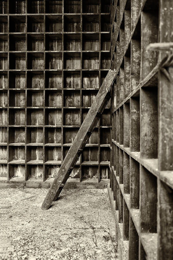 Architecture Photograph - Derelict wooden storage area by Russ Dixon