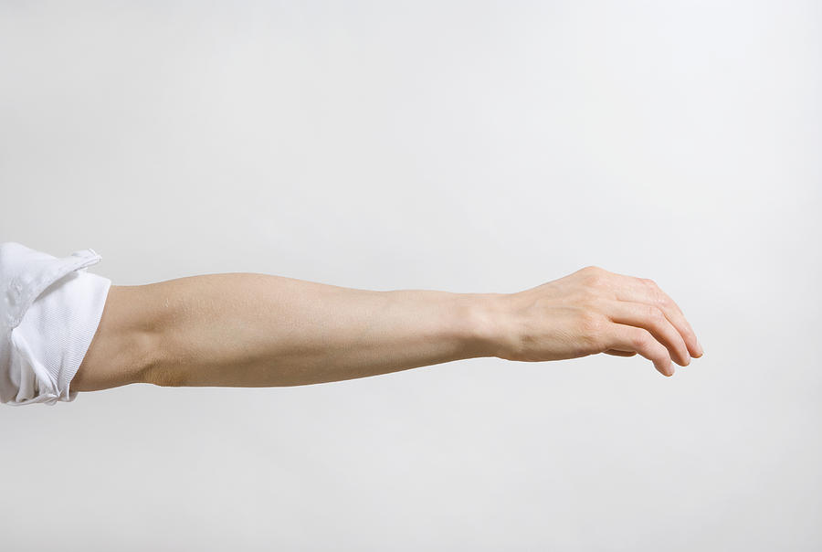 Detail of a mans arm outstretched Photograph by Halfdark