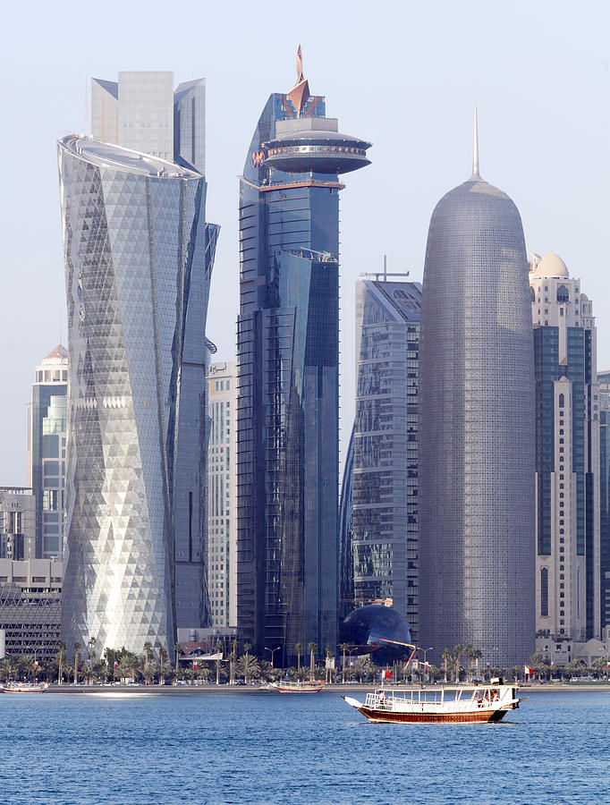 Dhow and Doha towers Photograph by Paul Cowan