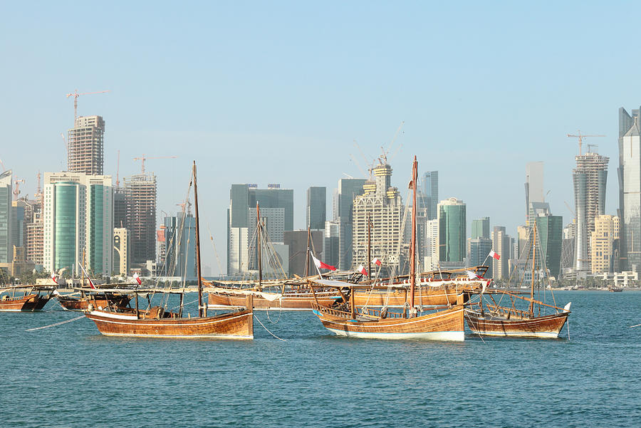 Dhows and Doha skyline 2012 Photograph by Paul Cowan