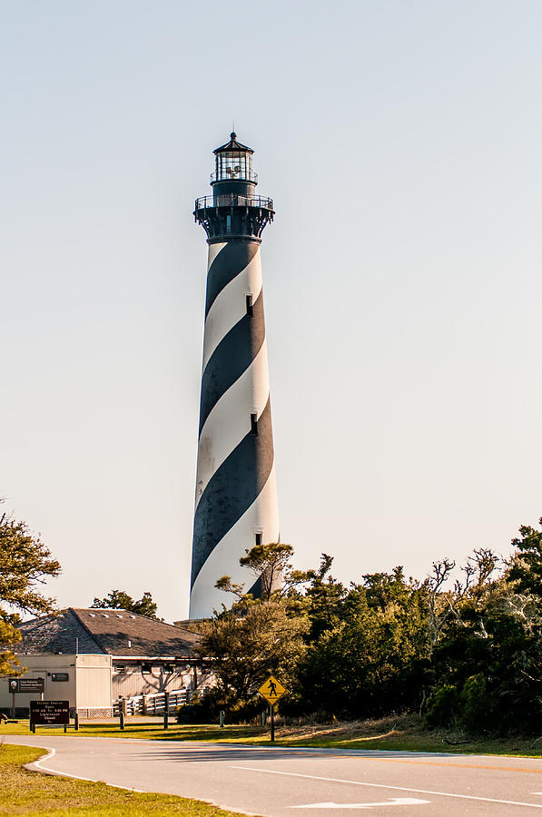 Diagonal black and white stripes mark the Cape Hatteras lighthou Photograph by Alex Grichenko