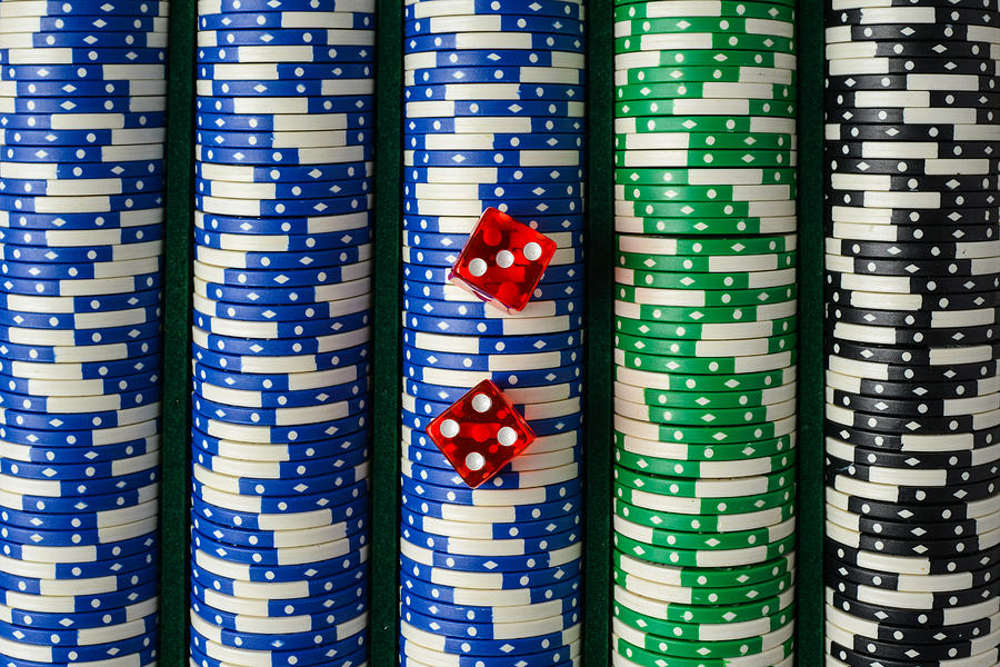 Dice on a Stack of Poker Chips Photograph by Brandon Bourdages