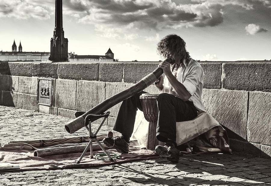 Didgeridoo Player on The Charles Bridge. Prague Photograph by Jenny Rainbow