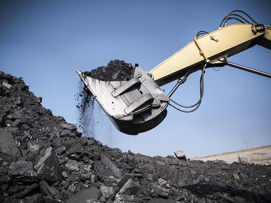 Digger lifting coal from opencast coalmine Photograph by Monty Rakusen