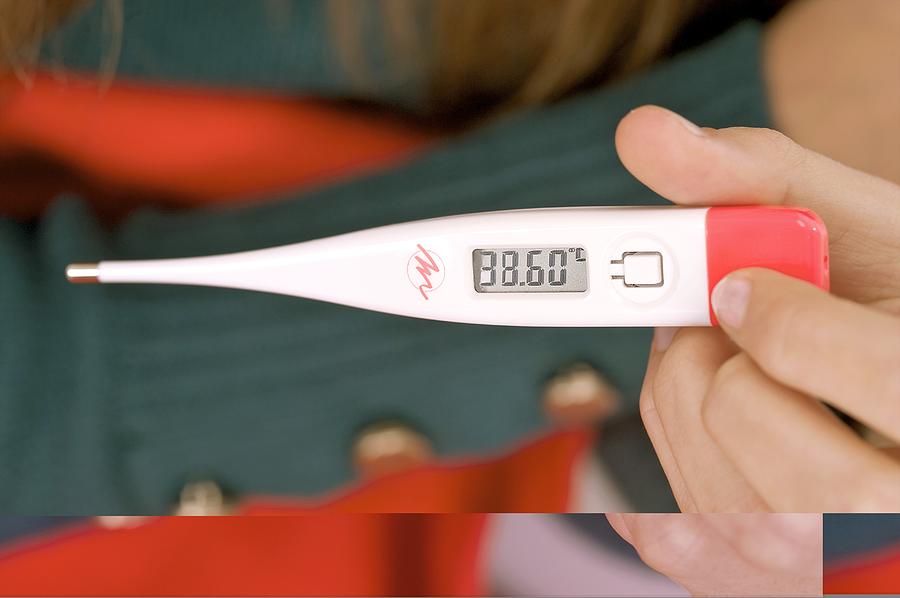 Device Photograph - Digital thermometer showing fever by Science Photo Library