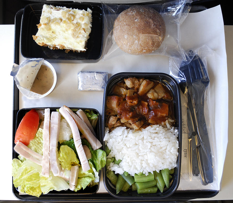 Dinner on an airplane Photograph by Groveb