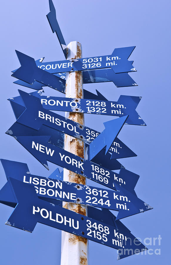 Directions Around The World Signs Photograph by Bill Bachmann