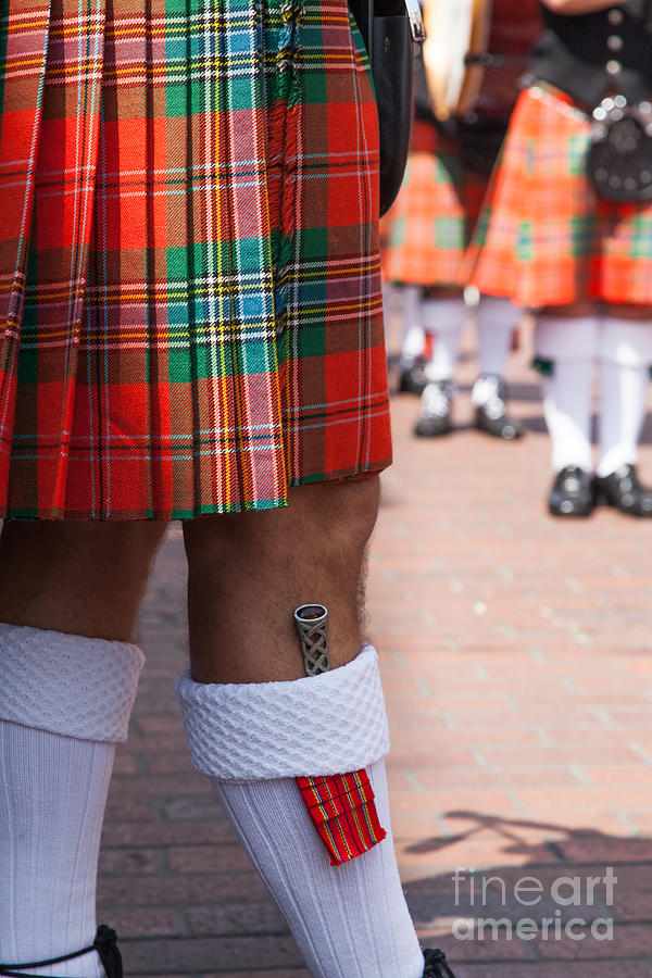 dirk in sock with kilt of scottish bagpipe player in Chichester  Photograph by Peter Noyce