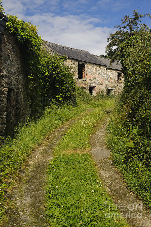 Dirt Path To Stone Building Photograph by John Shaw