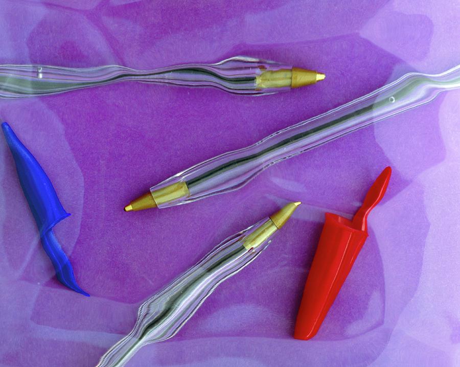 Distorted Image Of Ball-point Pens Photograph by Adrienne Hart-davis/science Photo Library