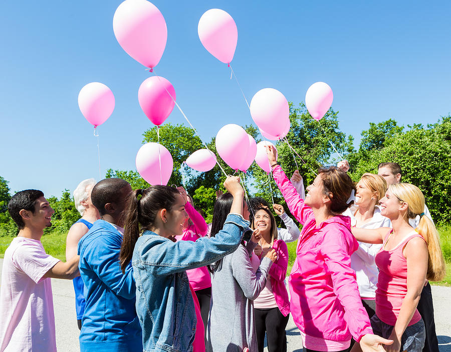 Diverse group of survivors releasing balloons for breast cancer awarness Photograph by Steve Debenport